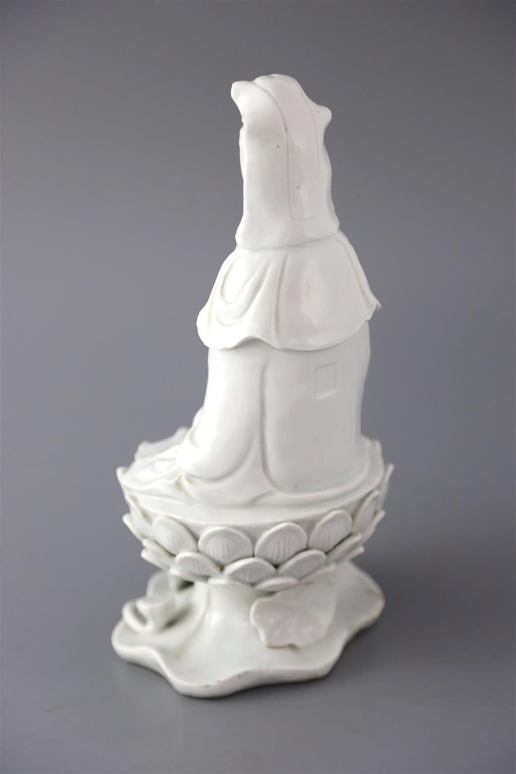 A Chinese Dehua blanc de chine seated figure of Guanyin, 18th/19th century, 25cm high